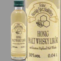 Der Honig-Malt-Whisky-Likör in der Mini-Flasche mit...